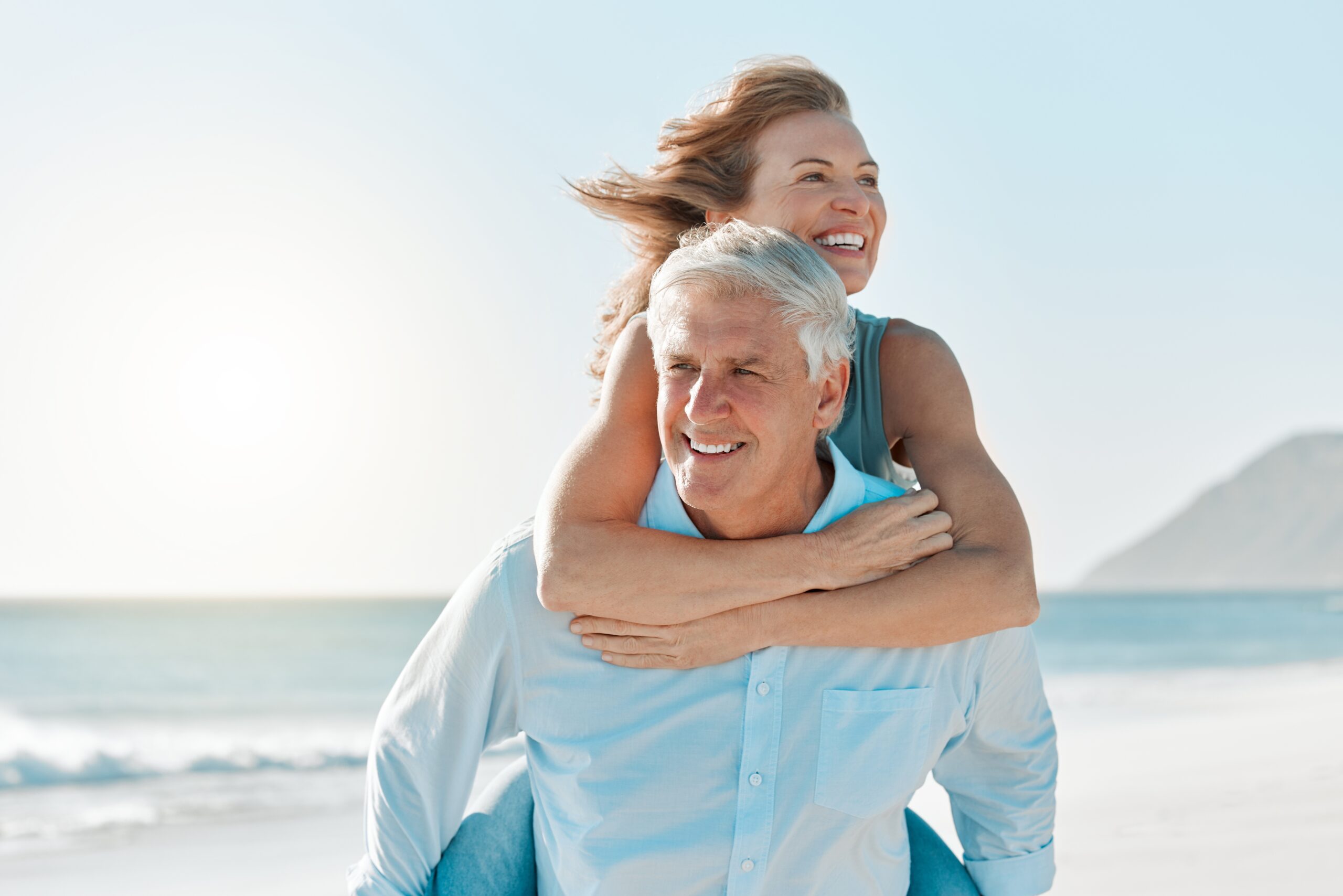 Love,,Piggyback,And,Walking,With,Old,Couple,At,Beach,For